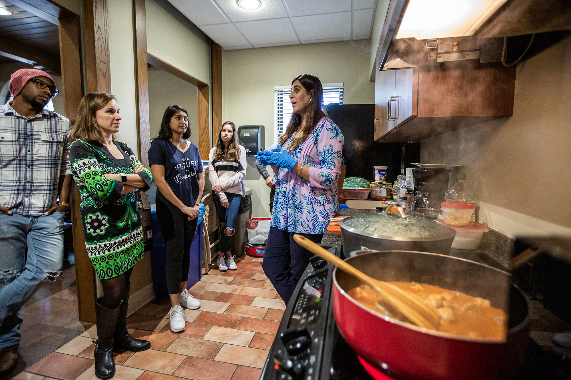 Students learn to cook dishes from local immigrants.