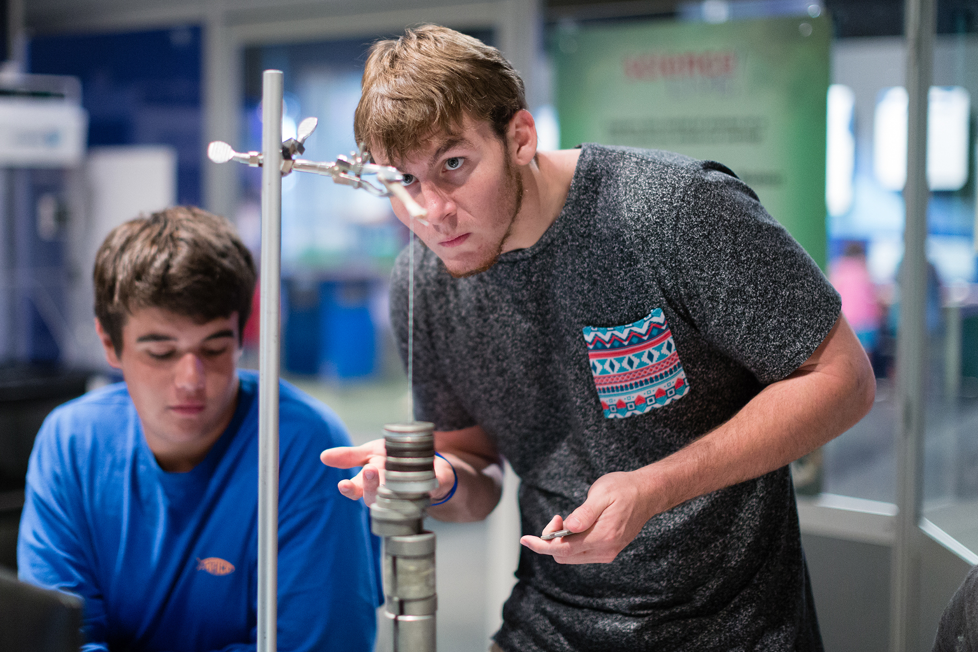 Rollins students performing a physics experiment.