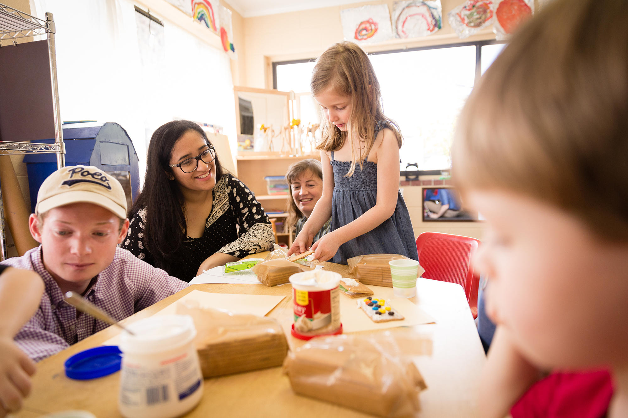Student working with children at Rollins’ Child Development Center.
